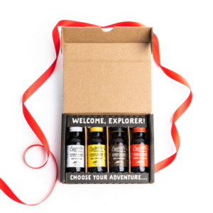 Four small cold-brew coffee bottles in a gift box