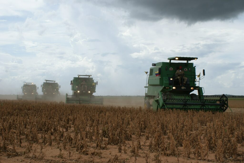 Farm equipment working on soy plantation