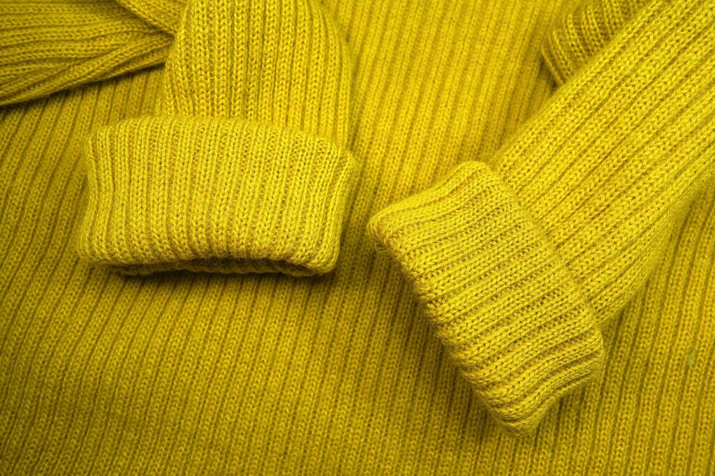 Close-up of yellow sweater