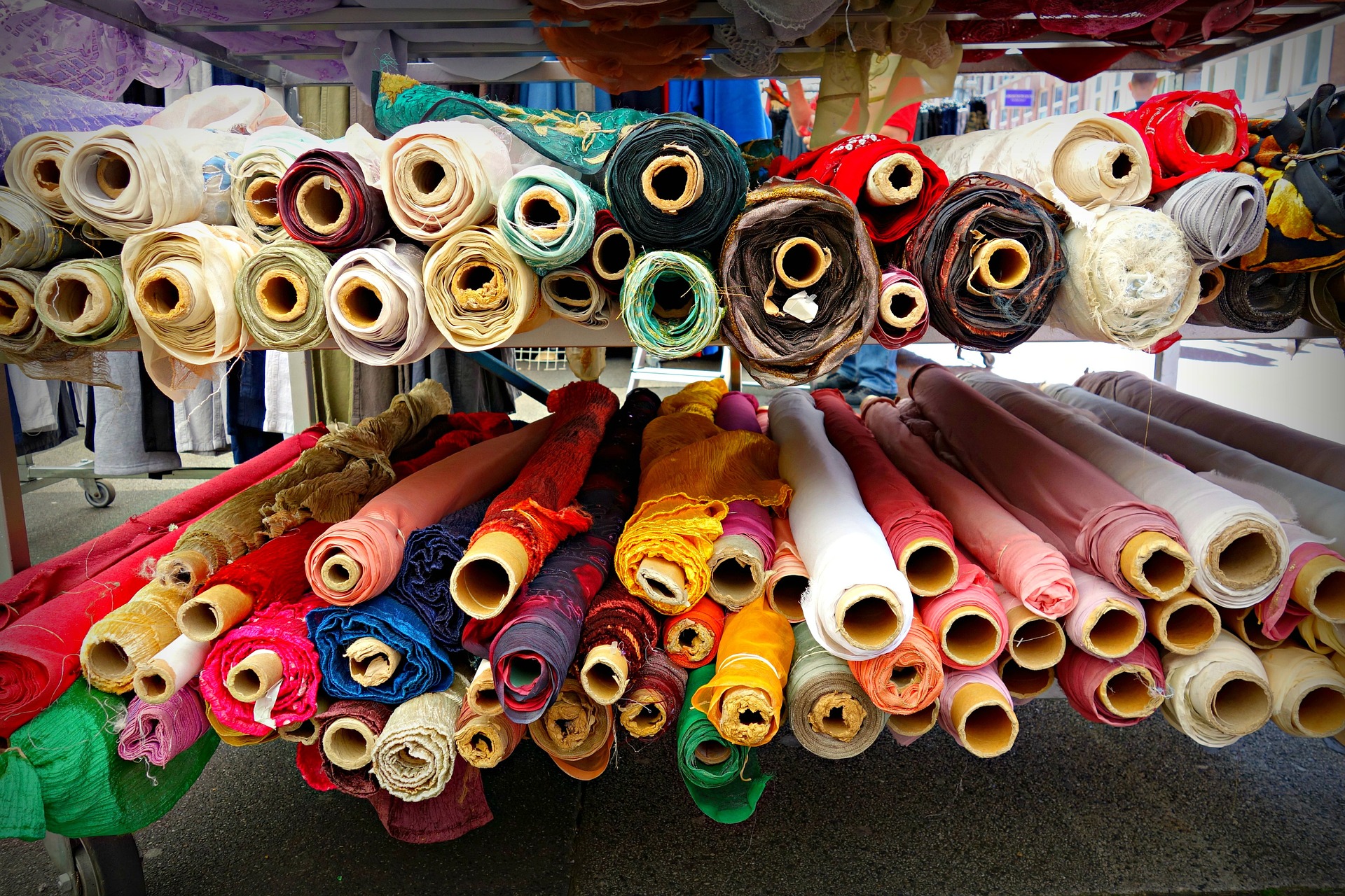 Rolls of fabric stacked in a store