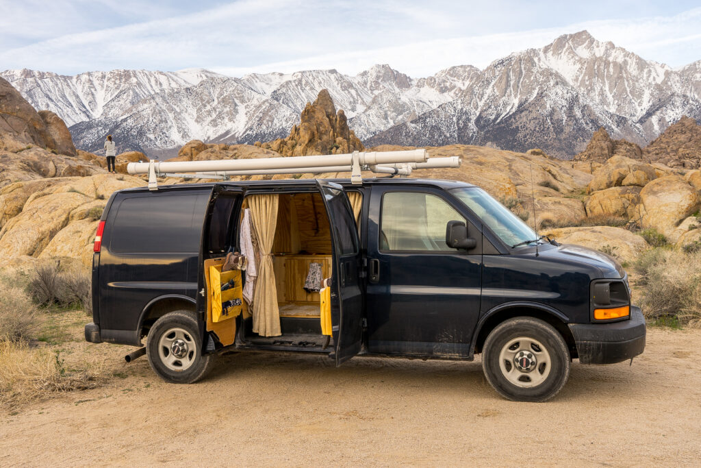 van parked in front of mountains
